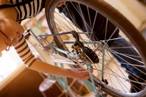 Woman maintaining her bike